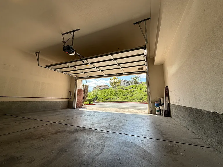 Private detached two-car garage with additional storage space.