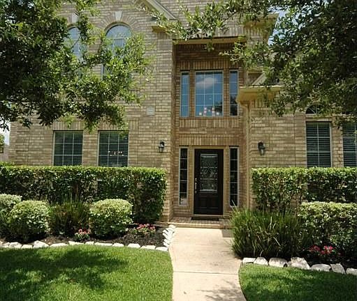 The walkway leading to the front door. The photo does show its beauty but this home is so much more pleasant to see in person!