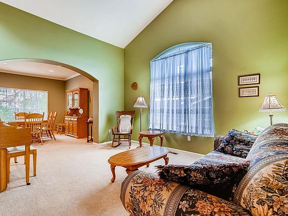 Formal living room opens to formal dining room, perfect for entertaining!