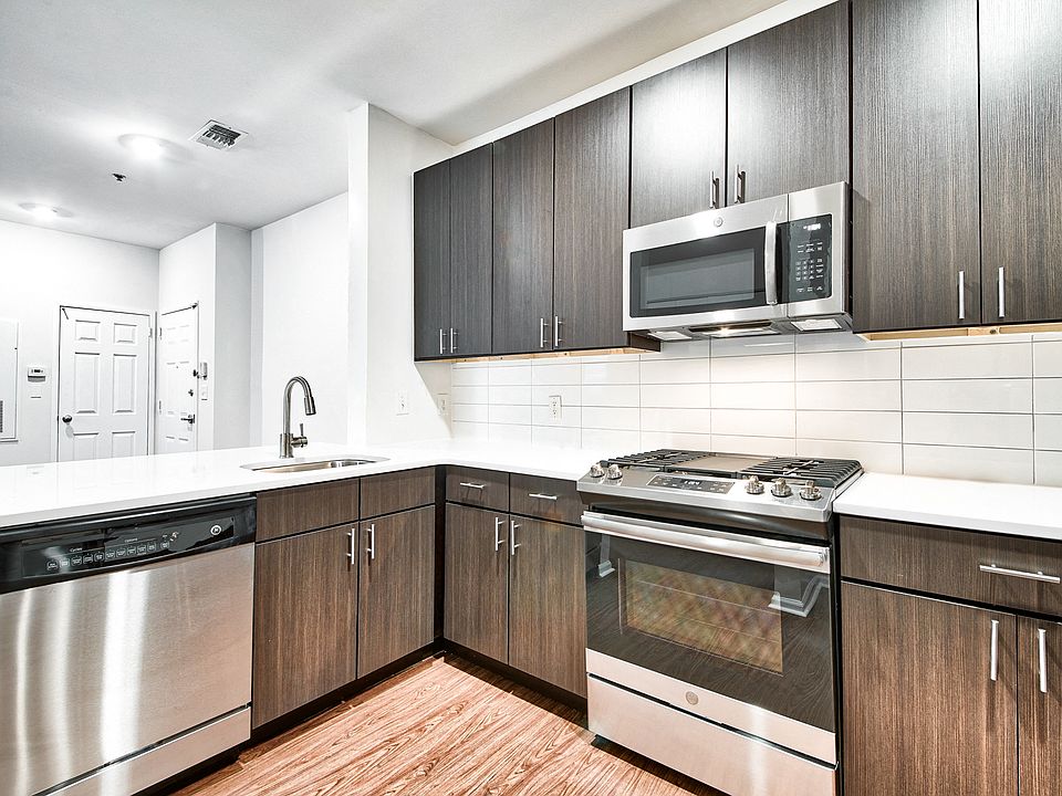 Renovated, chef-inspired kitchen with tiled backsplash