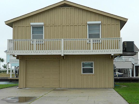 Attached garage and large driveway provides additional parking for guests.