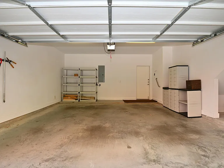 2 car garage space with storage nook and extra storage racks on ceiling (recently installed).