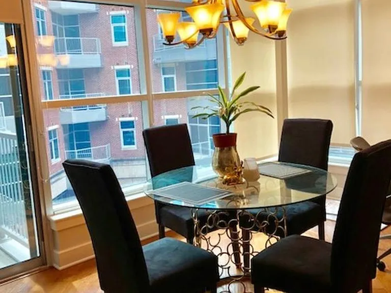 Dining overlooking garden with tons of natural lighting.