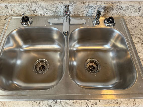 Stainless sink and Delta faucet.