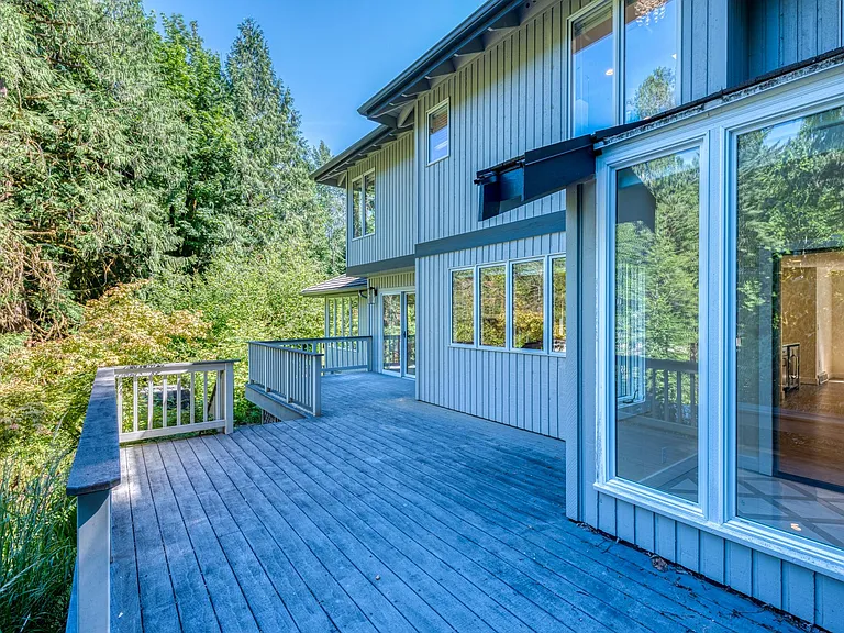 Huge wrap around deck in the backyard that leads down to the patio area!