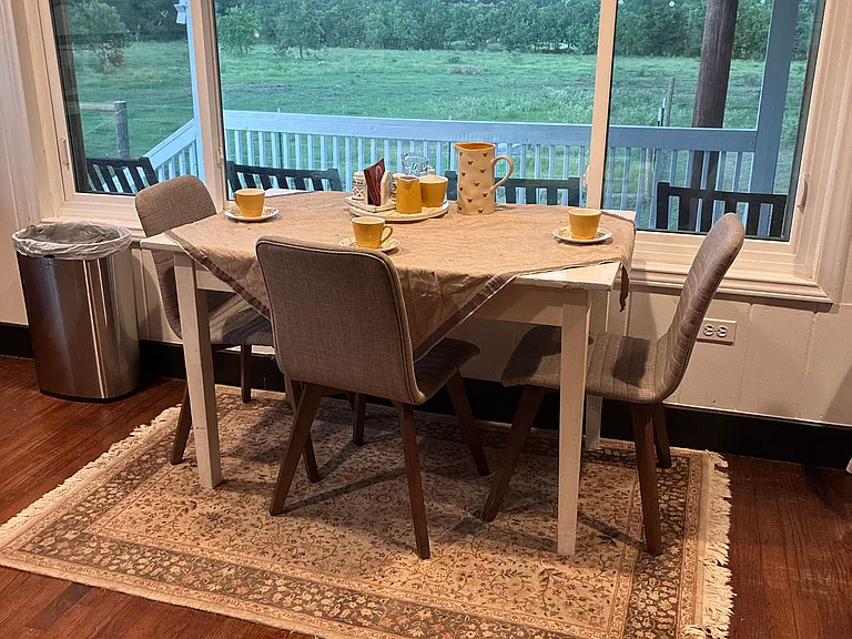 Breakfast nook in kitchen overlooking back pasture