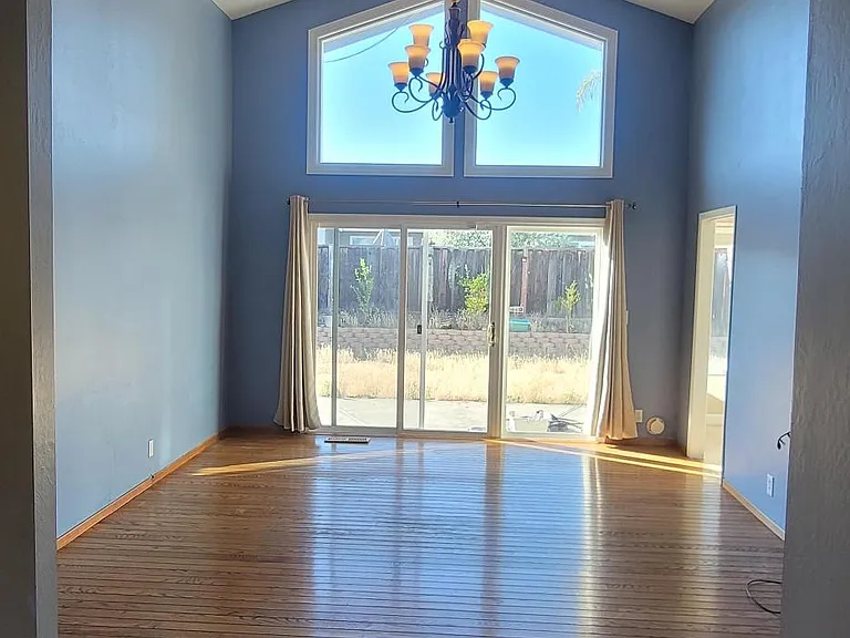 Soaring vaulted ceilings and abundant natural light create an open, inviting living space.