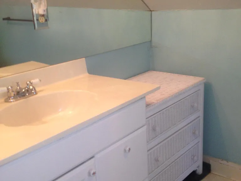 bathroom sink with large mirrors