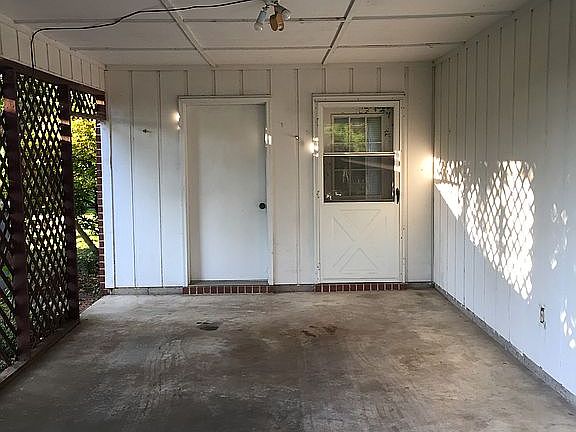 Carport with storage room 