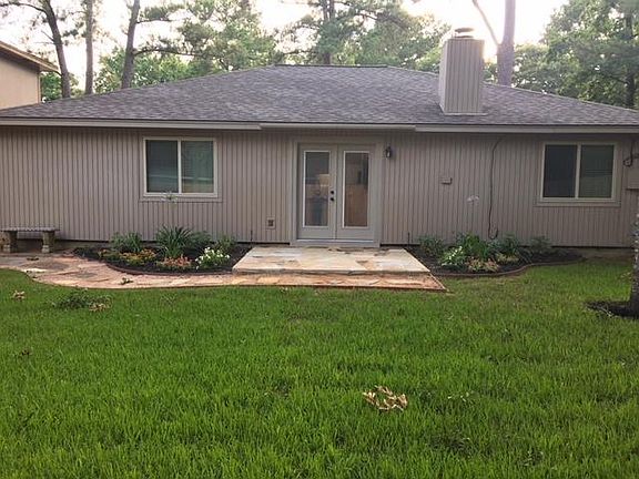 Unique stone back deck with large, private backyard.