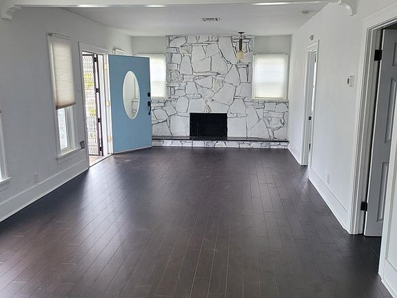 Living room, entry way, 1 of 2 fireplaces