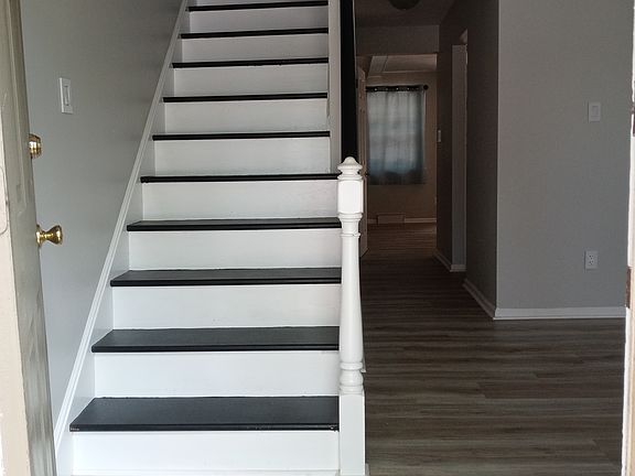 Entry through front door. On Left, Stairs to upstairs. On the Right Large room, tailored to your needs (dining room, toys, office, entertainment).
