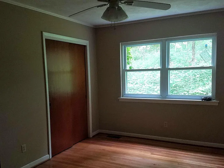 Middle bedroom in the wintertime. All bedrooms have a private feel with greenery outside.