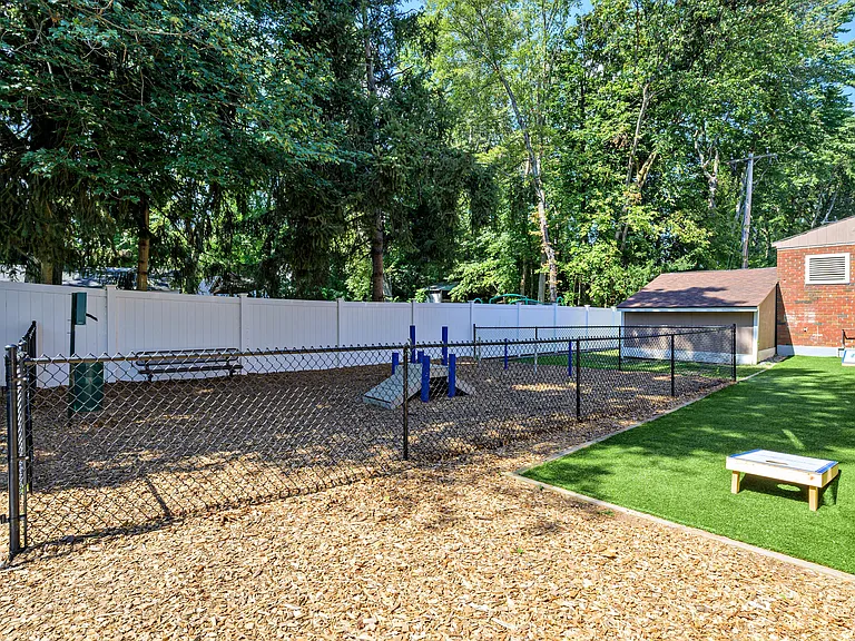 Bring your pup down to our off-leash dog park for some fun or play a game of cornhole.