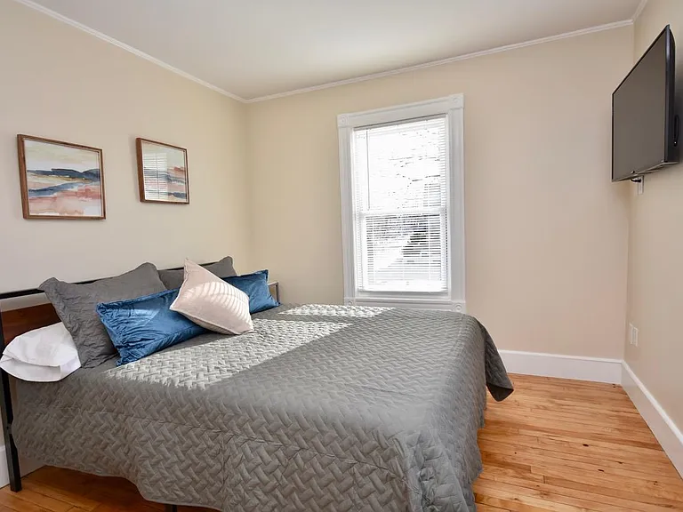 Bedroom with queen bed and 43" Smart TV, Payson Park and Back Cove View