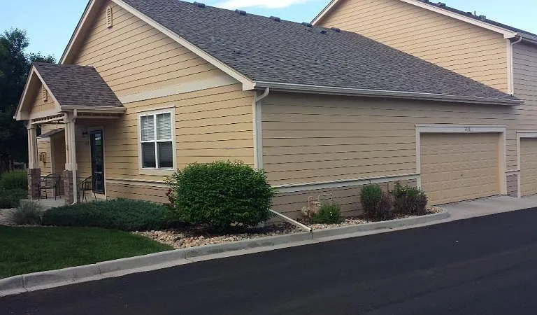 Two car attached garage with minimal stairs entering kitchen