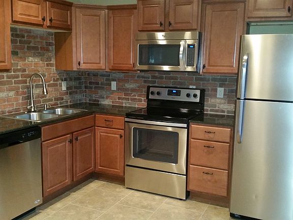 All new stainless kitchen appliances, solid surface counters