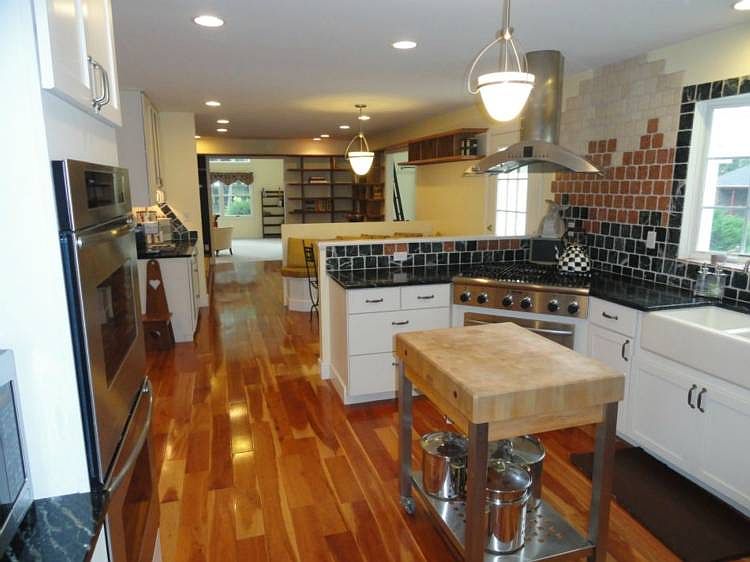 The chef in your life is going to be over-the-moon about their world-class kitchen that features pure extravagance from top to bottom. With names like Thermador and Bosch on the gleaming stainless steel appliances and the imported Swiss Woven Stainless Steel cabinet doors, the crisp, modern appeal of such premium finishes is unmatched. Not to be overlooked, the kitchen's sumptuous cherry floors compliment the ornate Italian tumbled stone ceramic backsplash and the imported Brazilian Soapstone counter tops perfectly. This kitchen marries the perfect mix of chic, dramatic opulence that a home like this one demands.