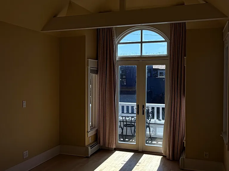 Primary bedroom with vaulted ceilings and private bath / walk in closets