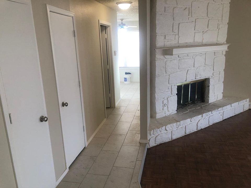 The hallway leads to the breakfast area and kitchen, the living room is to the right and is a step down. Fireplace just inspected and cleaned, woodburning with gas starter.
