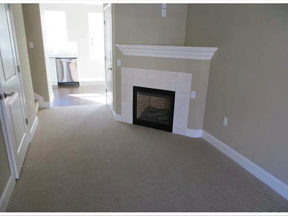 Fireplace + dining (attached to living room) + Entrance to half bath on left