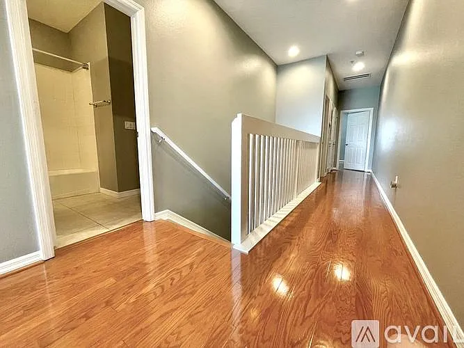 hallway to bedrooms and middle bathroom
