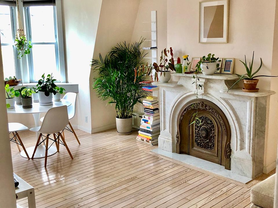 Living Room with hand carved marble decorative fireplace.