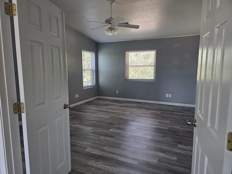 Double doors off the living room, lead to the large master bedroom.