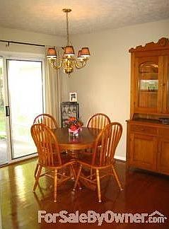 Dining room with gorgeous hardwoods
						:
						Sliding door from dining room opens to patio and backyard