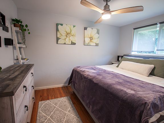 Primary bedroom with ceiling fan and large closet to the right. Also fits a king bed and large dresser.