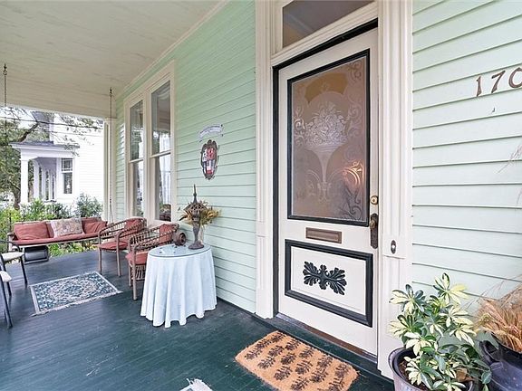 Doorway to property with covered porch