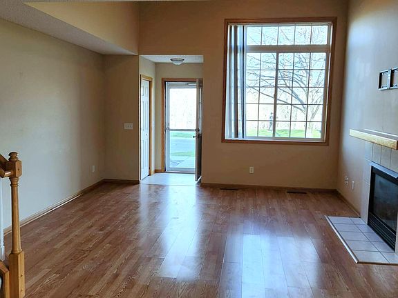 Vaulted Living Room with Gas Fireplace (View from Dining Room)