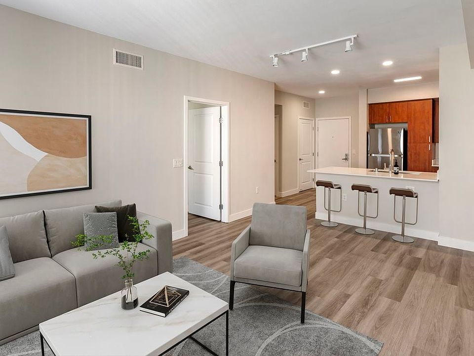 Renovated Package I kitchen, living and dining areas with hard surface flooring
