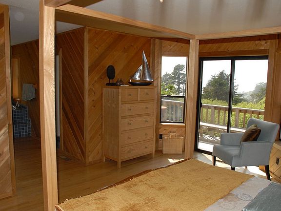 Master bedroom looking out to deck and views