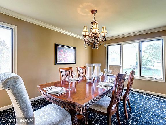 large sun-filled dining room w moldings