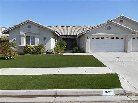 Picture perfect. That describes this home like the beautiful custom artificial turf lawn in both fro