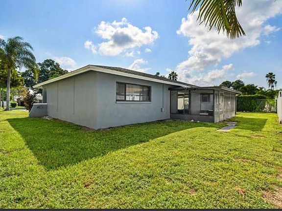 back of home including screened in back porch