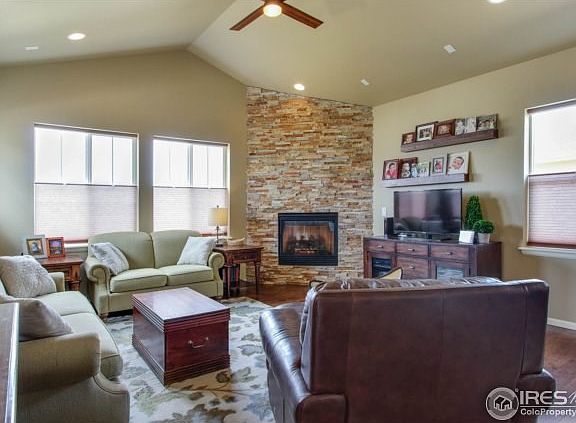 Warm living area with ample light & gas fireplace