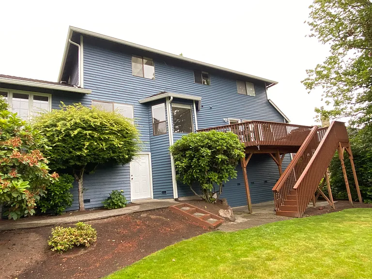 Backyard with large walk-in storage space