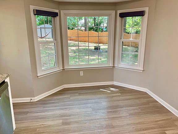 Breakfast nook overlooking shaded backyard