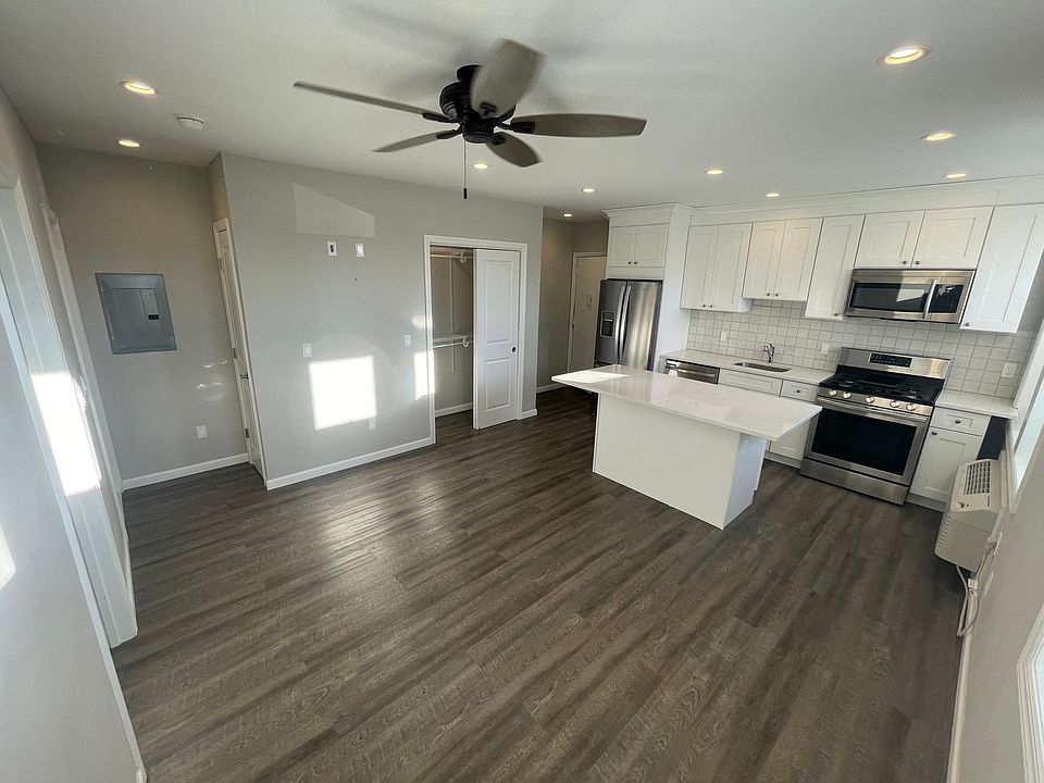 Kitchen living room and closet and main entrance at back left corner
