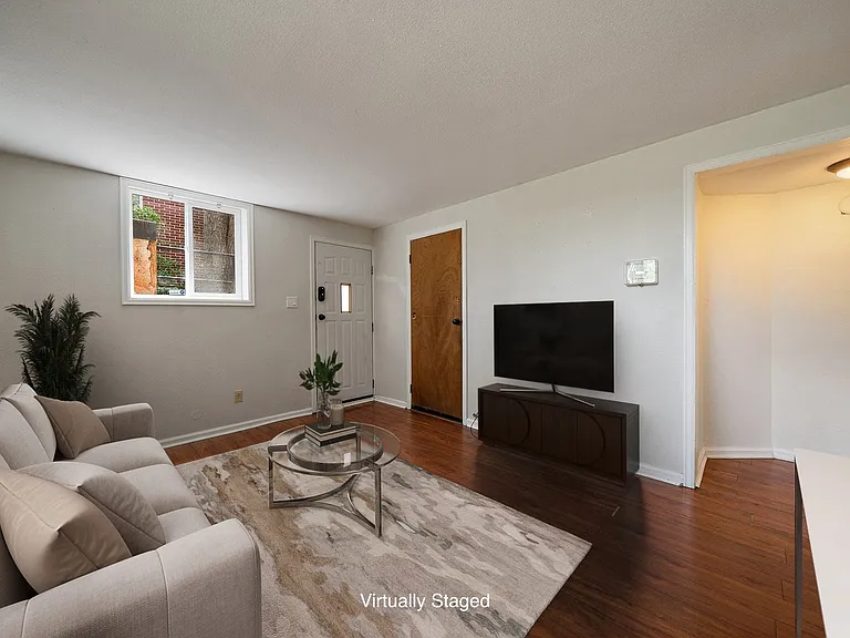 Living room with lots of East and Southern light (virtually staged)