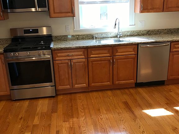 Newly renovated kitchen with all new appliances including dishwasher and microwave