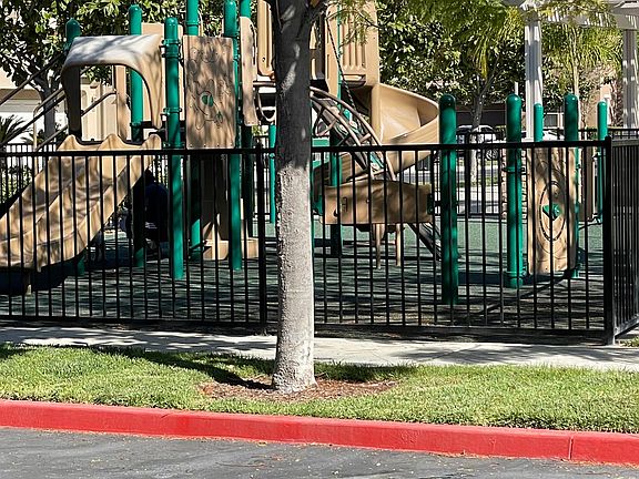 Gated playground next to the picnic area.