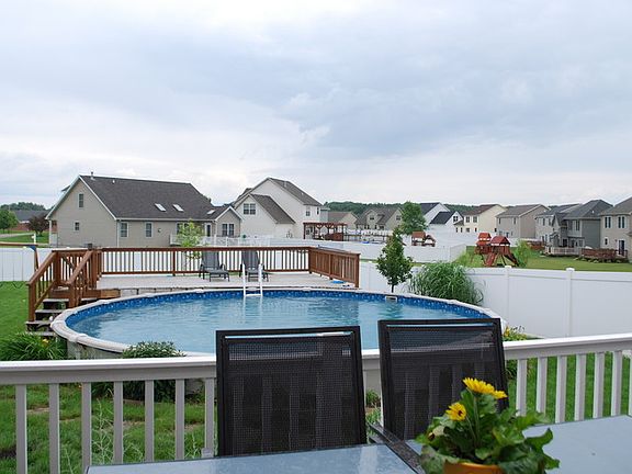 Large backyard : 27 foot pool and two decks with lots of room to play