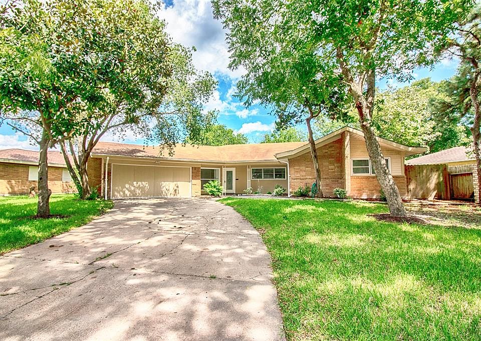 This just updated 5 bedroom home is on a quiet street lined with mature trees and has great curb appeal.