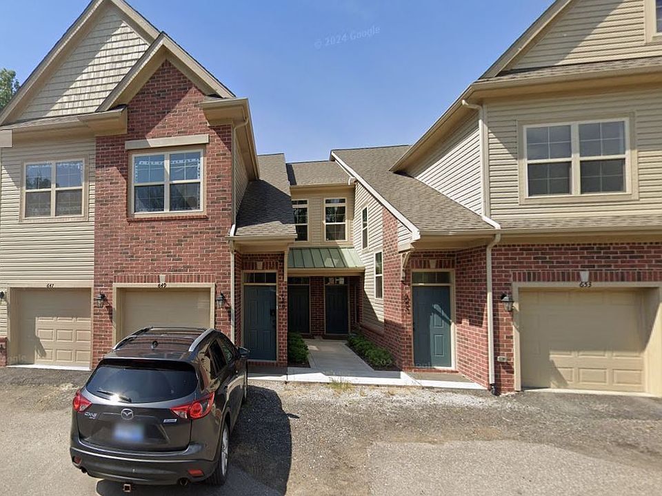 Main entrance, left garage door