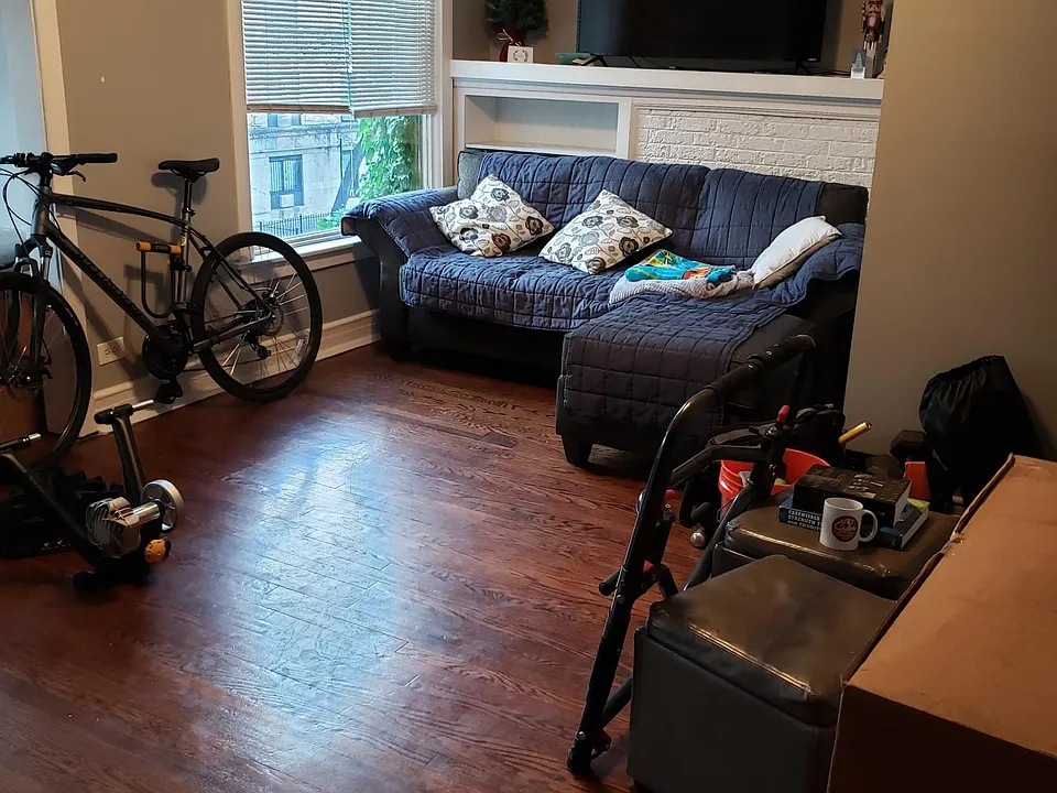 LIVING ROOM WITH DECORATIVE FIRE PLACE (BEHIND COUCH)
