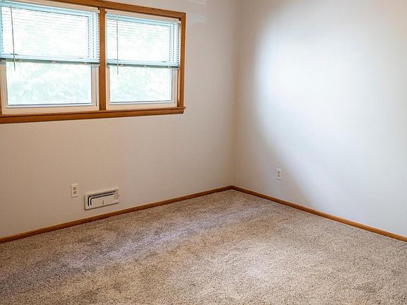 Smaller back bedroom. Standard style closet that is deep and wide.