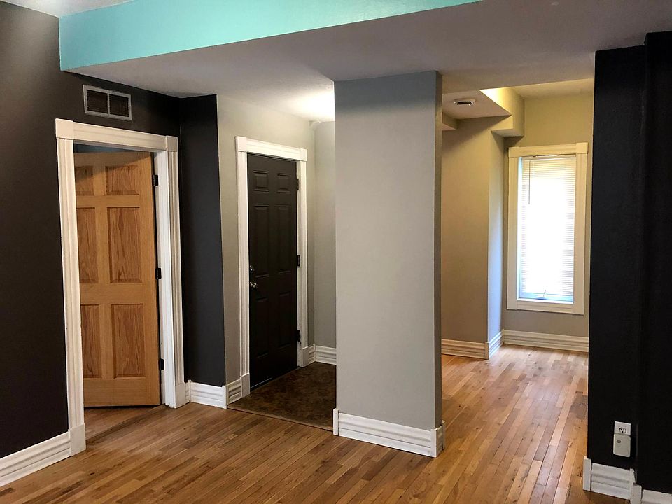 Front entry and entrance to bedroom #1. White oak floors throughout unit.